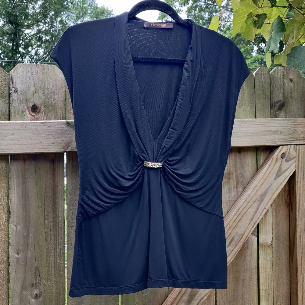 Stretchy black Roberto Cavalli top with metal/rhinestone accent.